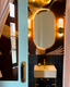 FAENA oval brass wall light